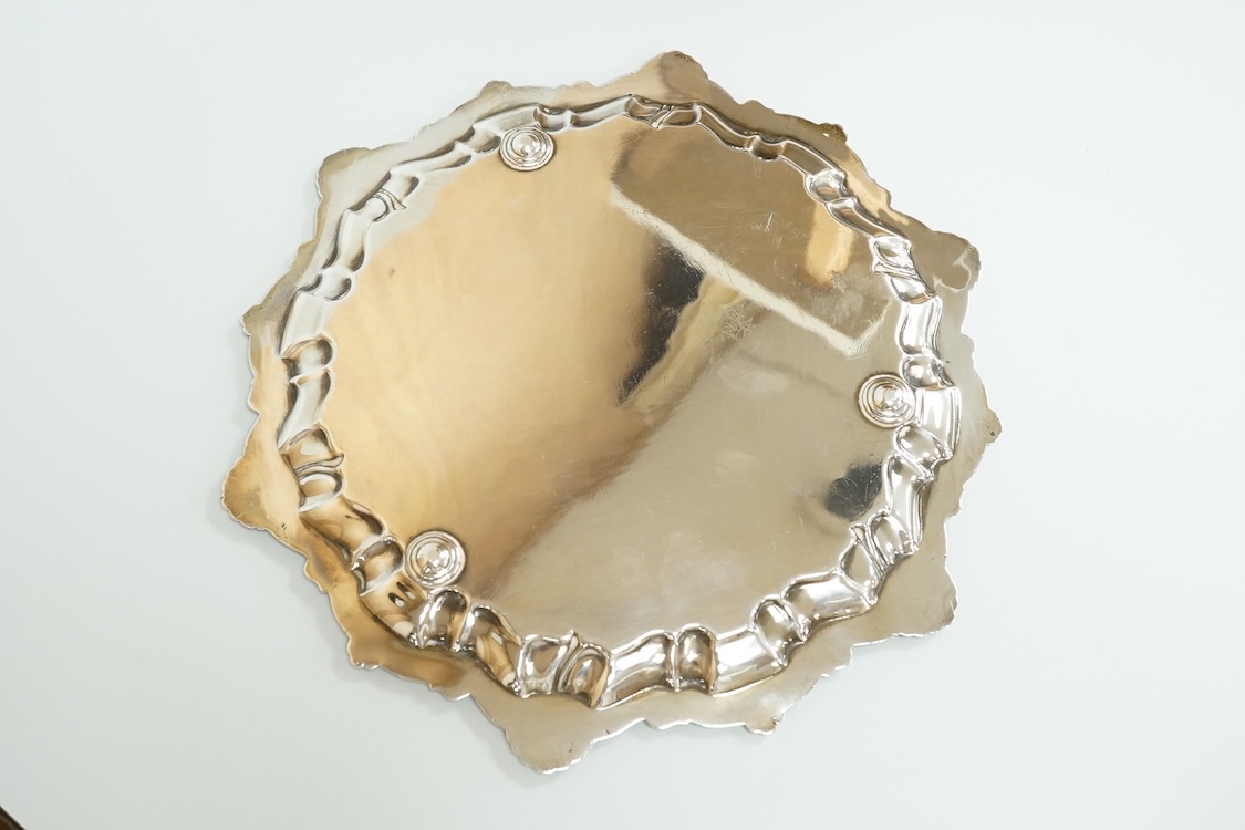 A George V silver salver by Alexander Clark & Co Ltd, of shaped circular form, with shell and scroll border, Birmingham, 1931, 27cm, 16oz.